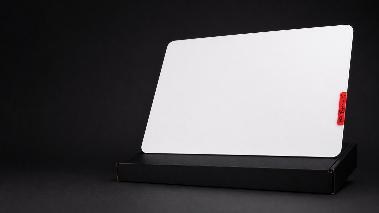 White Flash Beyond GP2 glass gaming mouse pad on a black studio background